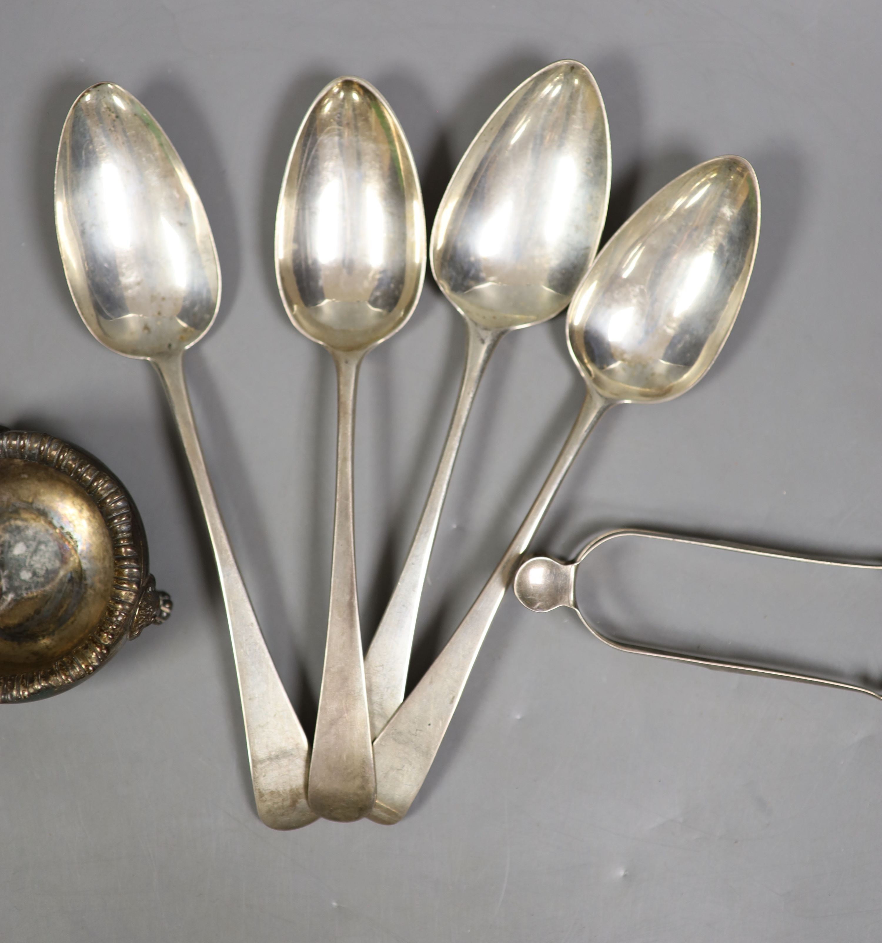 Four various George III silver Old English pattern tablespoons, a later silver salt and pair of silver sugar tongs, 11oz.